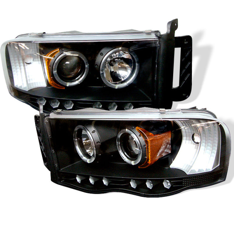 Spyder Dodge Ram 1500 02-05/Ram 2500 03-05 projector headlights with LED halo, black design.