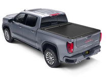 Load image into Gallery viewer, Roll-N-Lock 09-18 RAM 1500 / 10-22 RAM 2500-3500 (76.3in. Bed Length) A-Series XT Retractable Cover